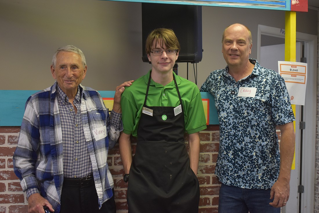 Vincent Contino and Craig Miller mentor Parrish Williford through the Money Talks Program at Harbor 58. They have helped him get a part time job and learn how to save and manage finances.
