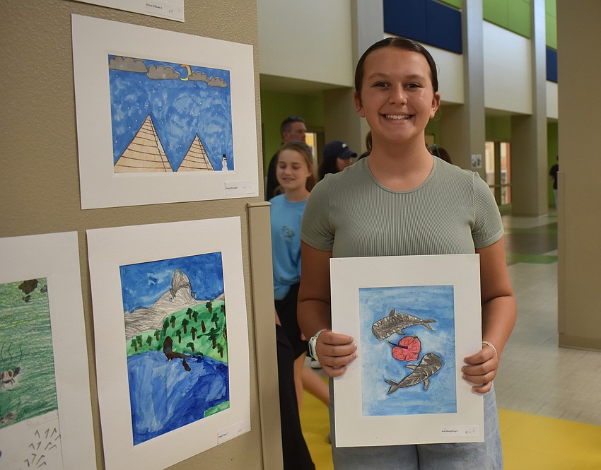 Ava Hempfling, a sixth grade student, wants to be a marine biologist. She decided to draw her favorite sea animal — two tiger sharks surrounding her favorite flower, a hibiscus.