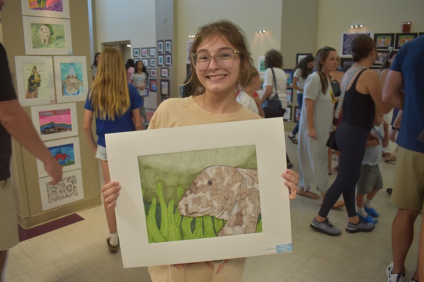 Nicasia Fayer, an eighth grader, thinks manatees are cute and has always wanted to pet them. She used acrylic markers, pencil and black pen.