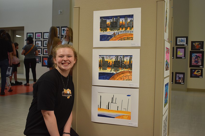 Mollie Schaeffer, an eighth grader at Mona Jain, created three pieces that go together. The top is a realistic city landscape, the middle is abstract  and the bottom is a nonobjective version of the same concept.