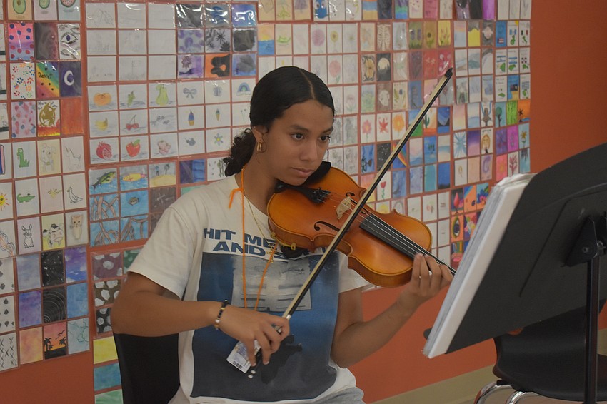 Mariella Martinez Reyes, a seventh grade student, has been playing violin for six years. She says she wants to do it for the rest of her life and dreams to go to a school such as Juilliard.