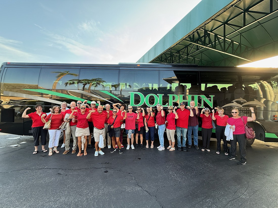 A group of Tara residents dons red shirts and takes a tour bus to Manatee County's Administration Building May 8 to oppose a development project.