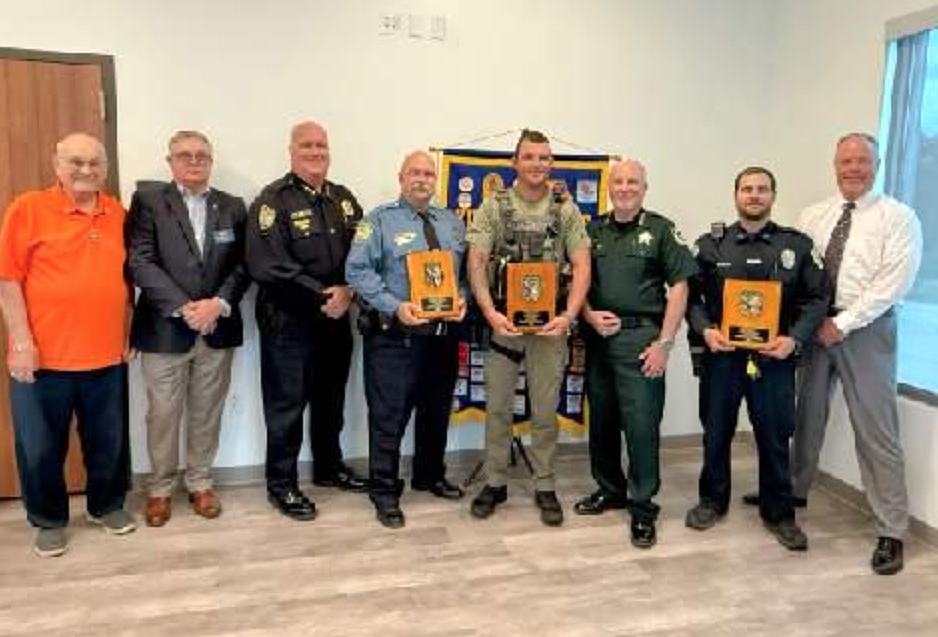 Kiwanians Frank Consentino and Club President Ed Pruitt, Bunnell Police Chief Dave Brannon, Public Safety Officer Rommel Scalf, Master Deputy Nick Champion, Flagler County Sheriff Rick Staly, Officer Morgan Snyder and Flagler Beach Chief Matthew Doughney. Courtesy photo by Maria Barbosa.