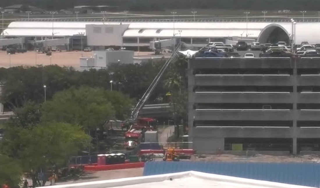 Firefighters are on the scene at Jacksonville International Airport at 1 p.m. May 16 for a blaze in the hourly parking garage. This image is from a News4Jax webcam.