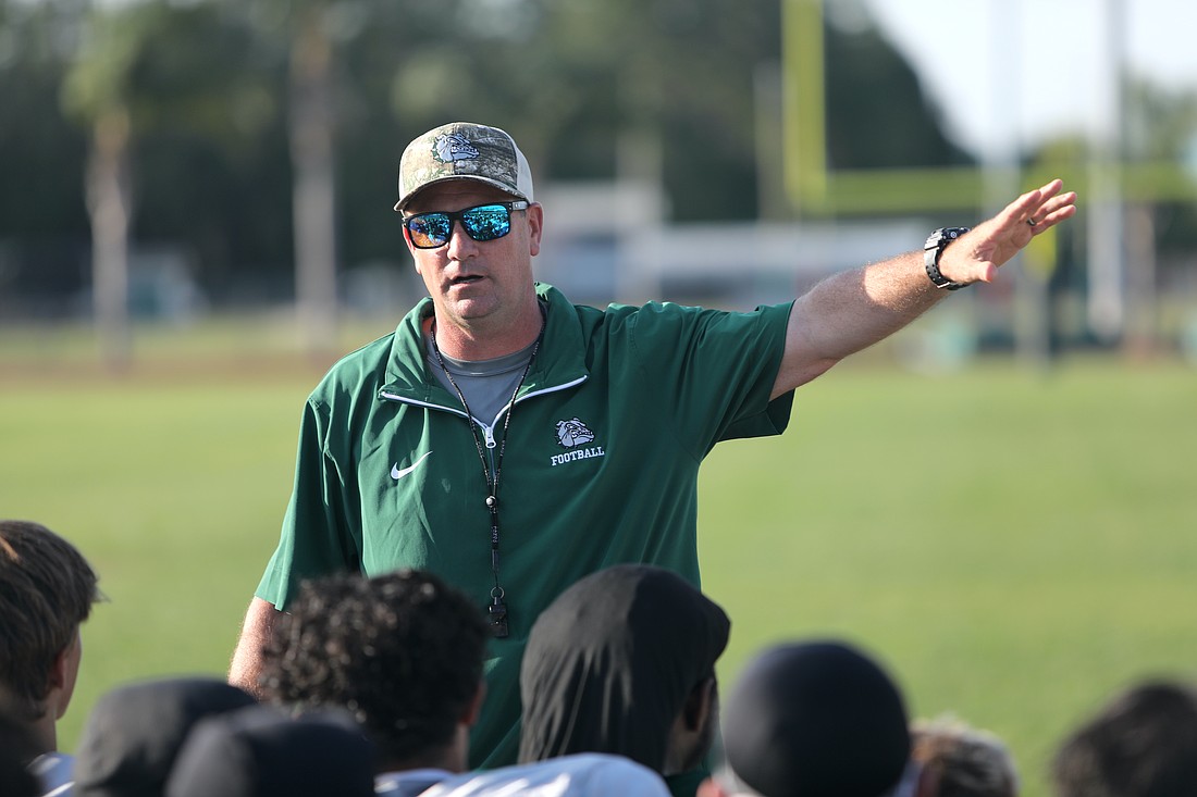 FPC coach Patrick Turner talks to his team after the Green and White scrimmage on May 16. Photo by Brent Woronoff