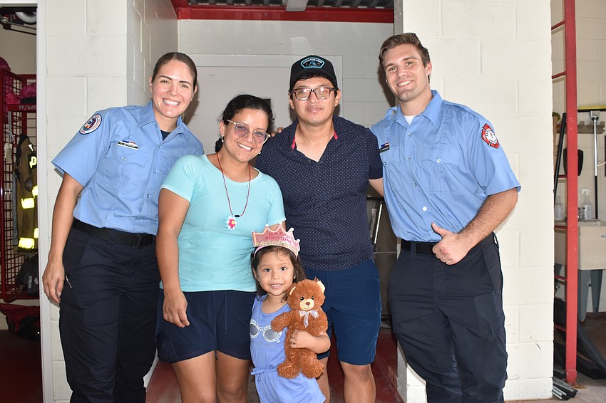firefighter/EMT Christina Newport, Catherine Sarmiento, Mia Isabella Urquiza, 4, and Raul Urquiza