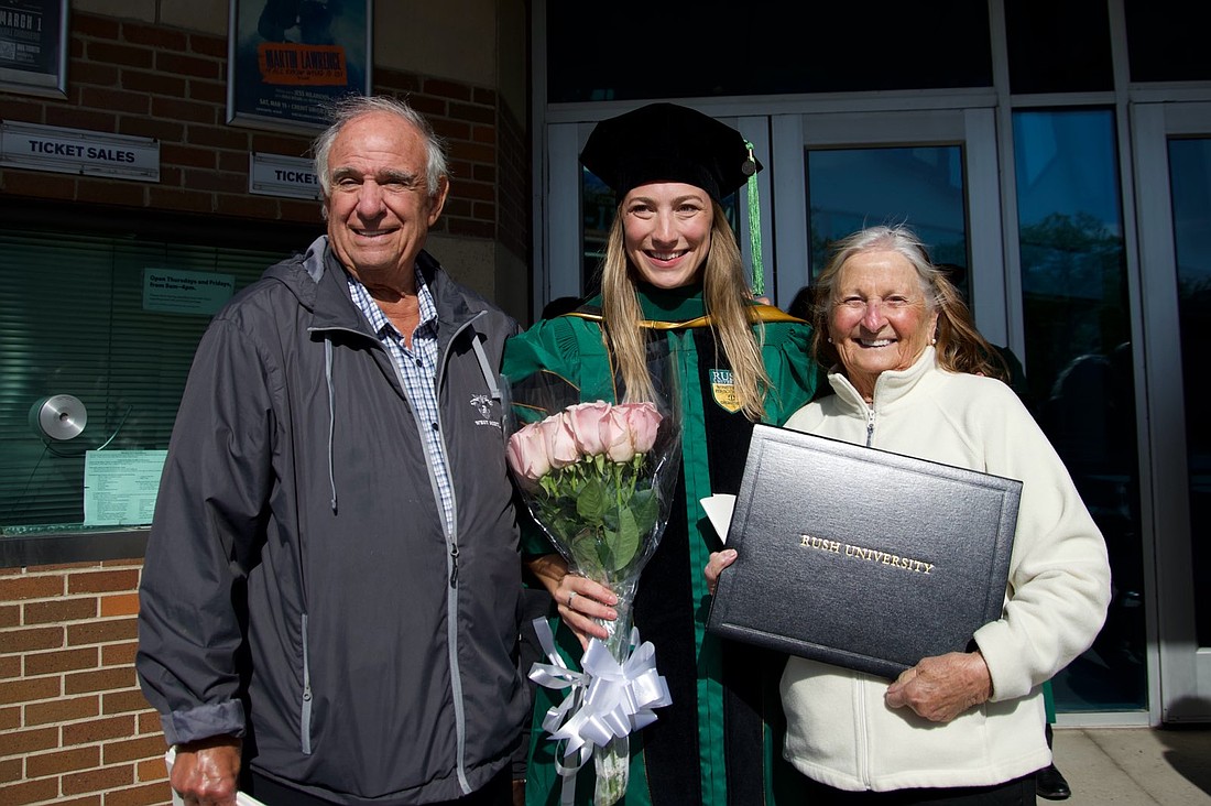 Samantha Esposito celebrates her graduation with grandparents Mabel and Anthony.