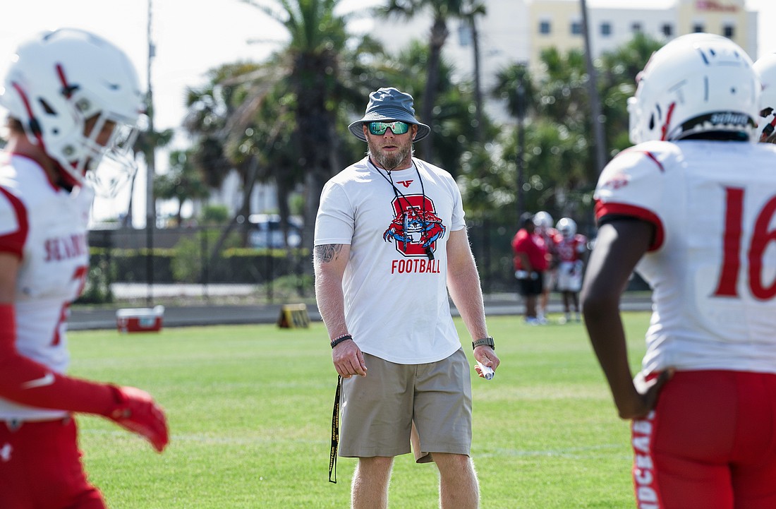 Seabreeze head football coach Mike Klein directs drills before the Red and White scrimmage on Saturday, May 17. Photo by Michele Meyers