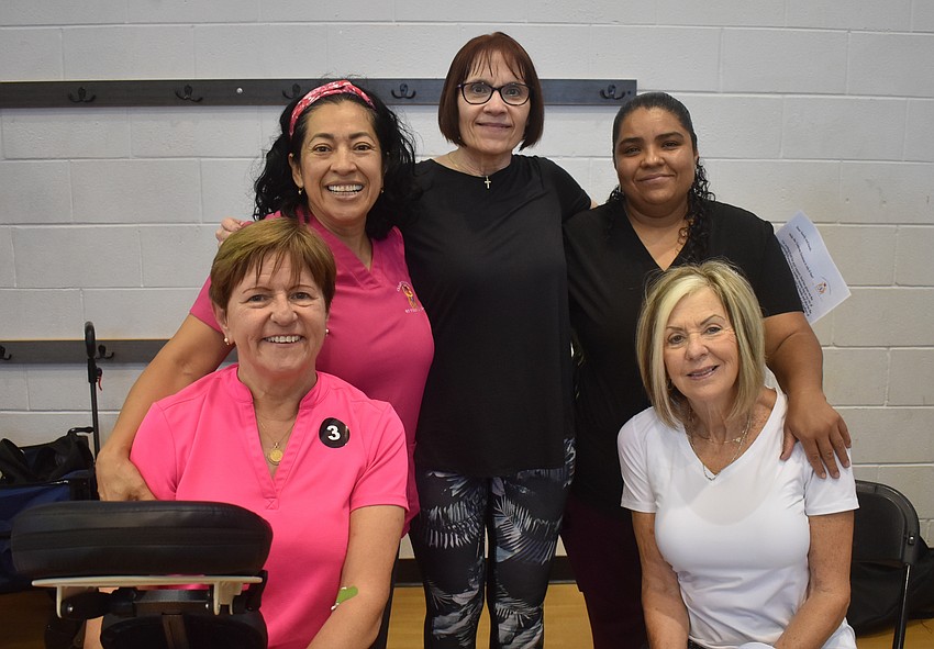 Sue Piatek(front left), Janet Tibbetts (front right), Carmen Wiersena (back left), Debbie Gehron (middle) and Julie Gonzales (back right) discuss Carmen's Concierge and Archwell Health.