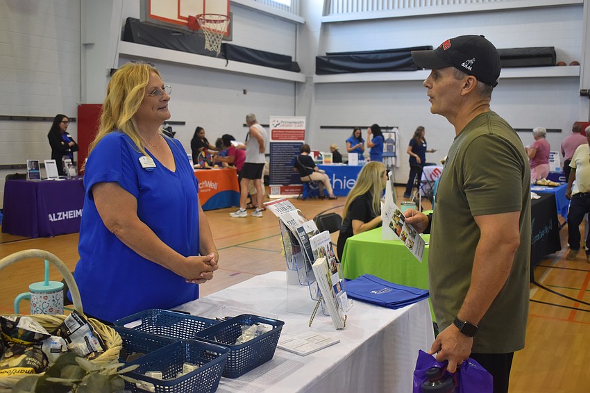 Lakewood Ranch resident Honz Keclik came to the senior fair in search of assisted living facilities for his mother. Stephanie McKinnon, executive director at senior living community Discovery Commons At Bradenton, shares information about their services.