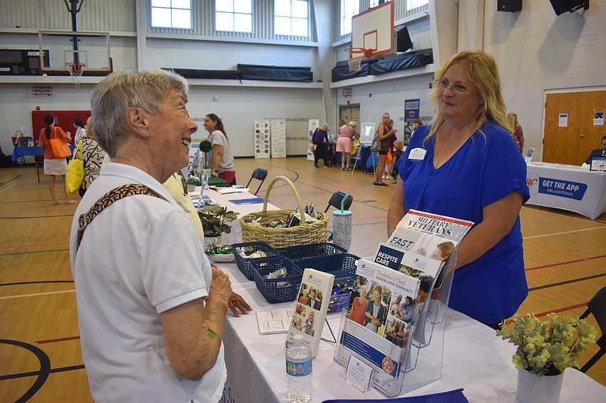Sarasota's Susan Walker learns more about Discovery Commons At Bradenton, a senior living community, from executive director Stephanie McKinnon.