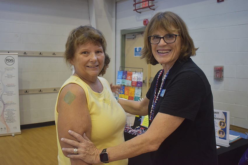 Creekwood's Sue Schwartz tries out a patch from The Super Patch Company that supposedly gives the user more balance and stability in seconds. She did a balance test with independent associate Sue Vipond and said she could tell the difference.