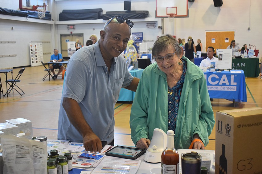 Ali Tahiiri, Naturali Pro LLC brand representative, tells Bradenton's Mary Orlando about a BioPhotonic Scanner which measures the level of concentration of antioxidants through scanning a hand.