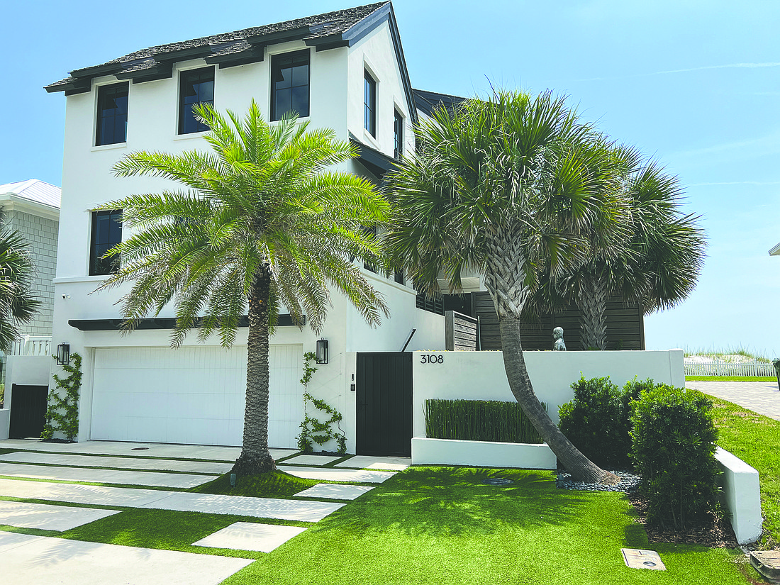 Oceanfront home features four bedrooms, six bathrooms, courtyard, entertainment room, elevator, balcony, porches and dune walkover.