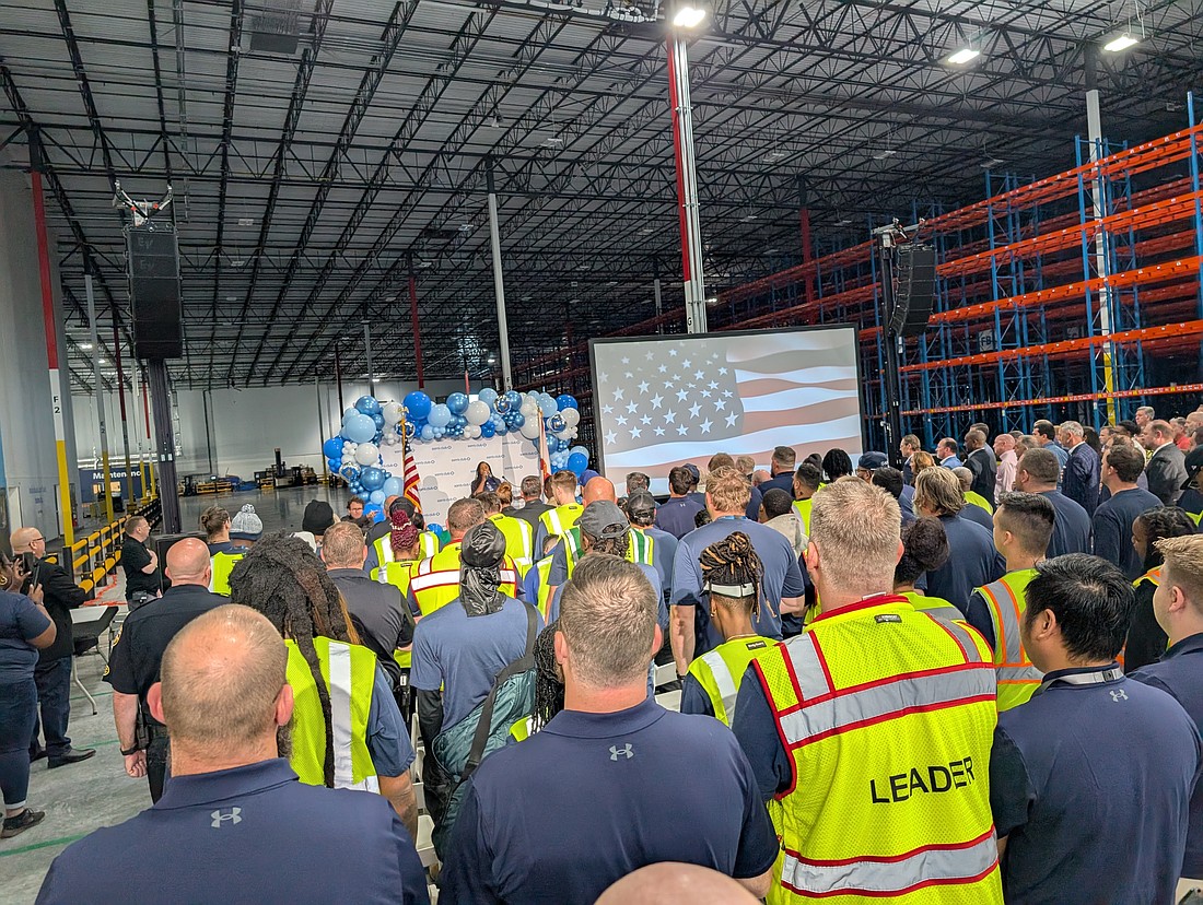 Workers and officials gather for the grand opening ceremony for the 1 million-square-foot Sam’s Club distribution center April 17 at 1511 Zoo Parkway, Building 300, in Imeson Park South in North Jacksonville.