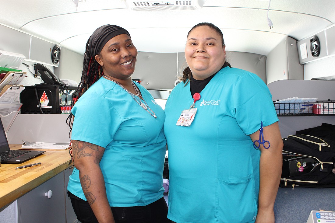 Phlebotomists Kierrah Stanford and Diana Lemus staff the SunCoast Blood Centers' "bloodmobile" stationed outside of Longboat Key Town Hall on May 21.