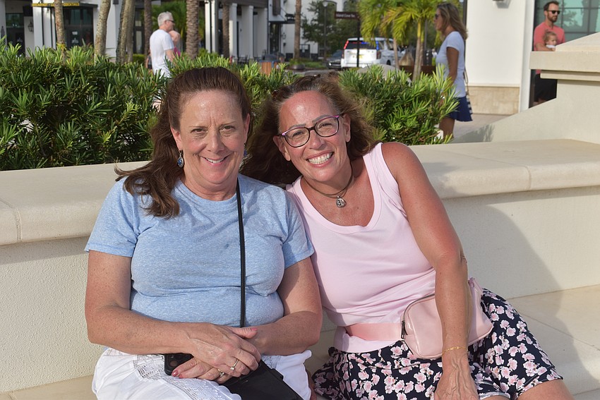 Sarasota's Tracy Quilty and Michelle Gudge enjoy watching the line dancing.