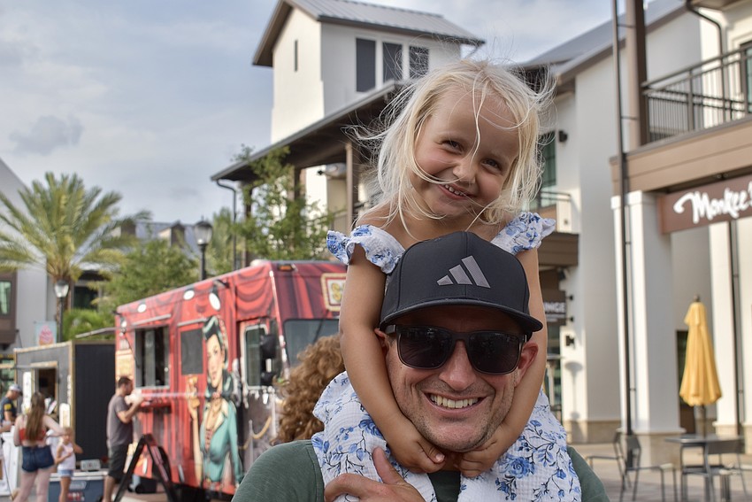 Emmi Kaski, 3, doesn't want any other seat but her dad Travis Kaski's shoulders.