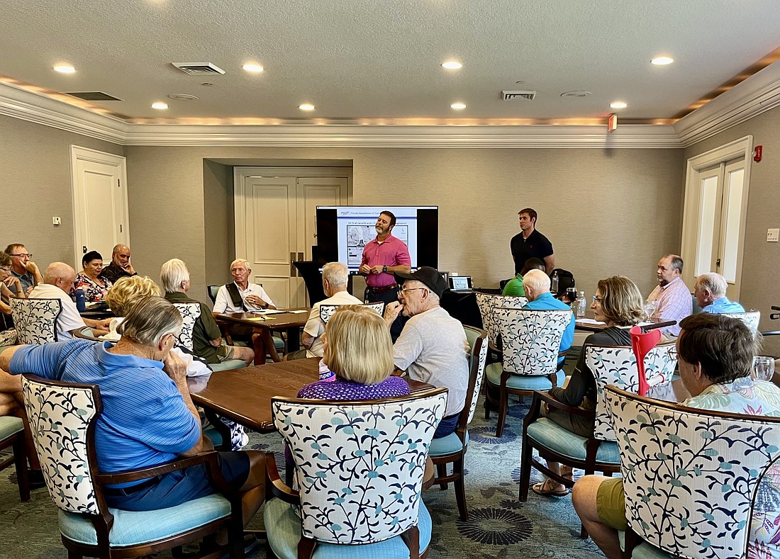 Walter Breuggeman with the Florida Department of Transportation and traffic engineering consultant Samuel Berkman give a presentation to Rosedale residents May 21.