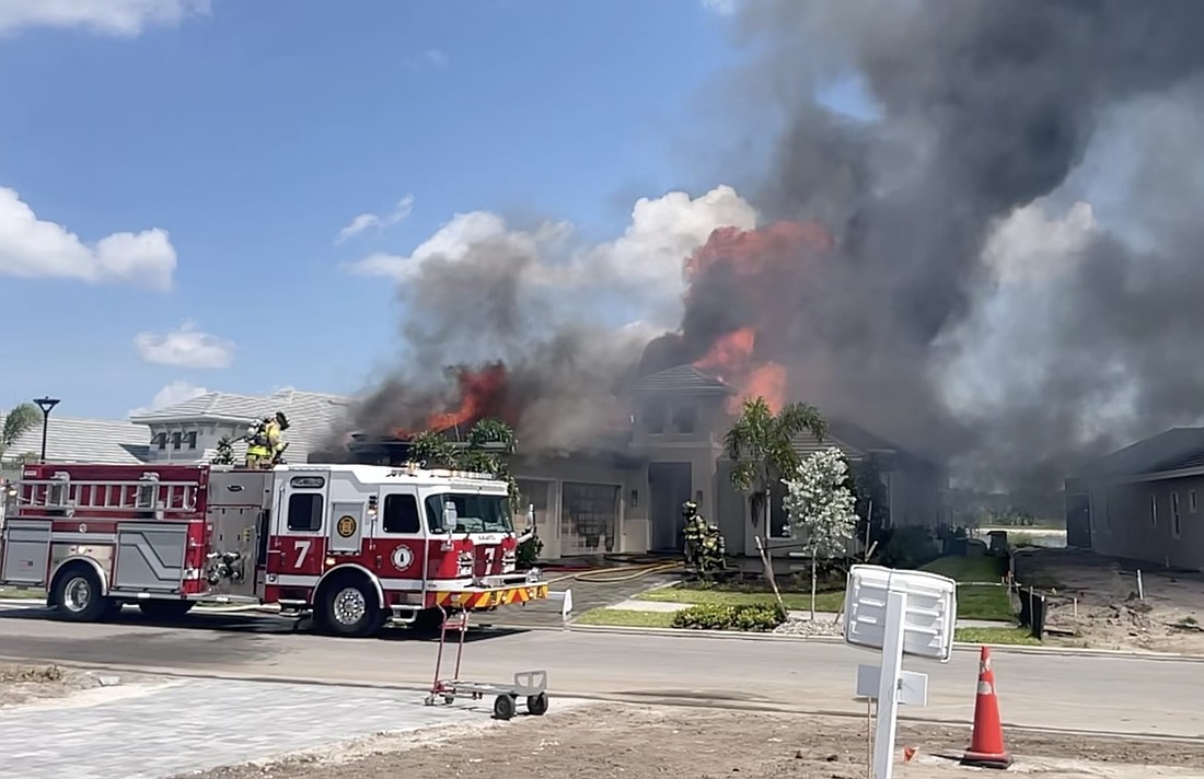 A single family home catches fire May 21. The home was under construction in Wild Blue at Waterside.