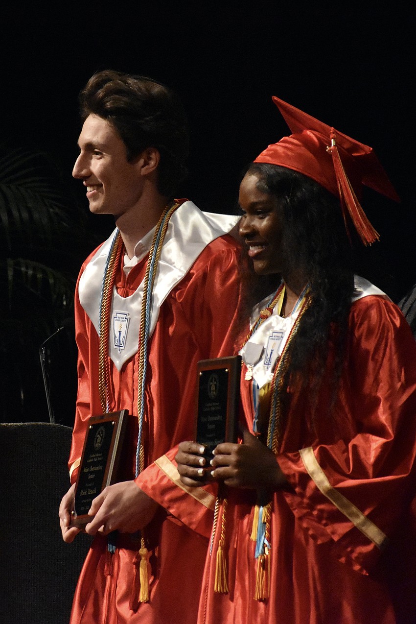 Mark Yencik, and Sy'monique Simon, the deliverer of the salutatorian address, were hoonred as the most outstanding male and female seniors.