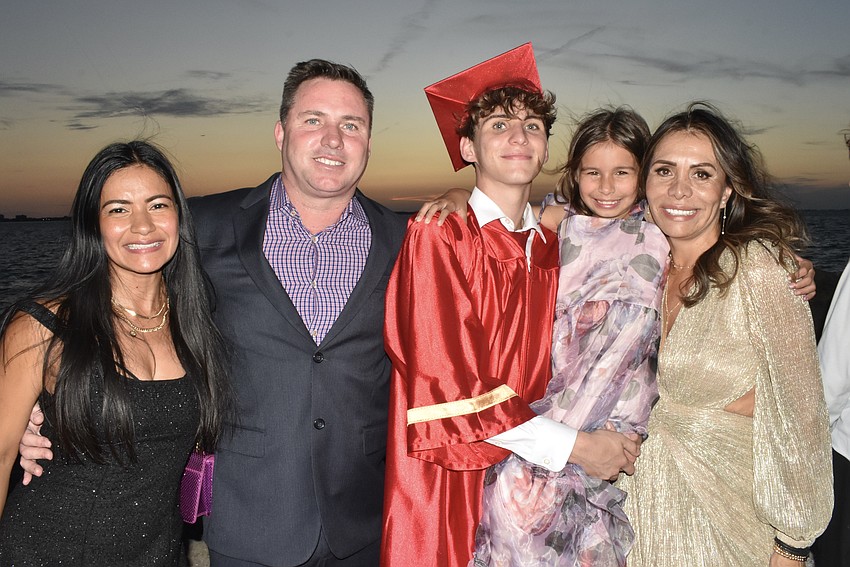 Graduate Emilio KInsella (center) poses with his stepmother Irene Kinsella, father Rick Kinsella, sister Sophie Kinsella, 7, and mother Claudia Wright.