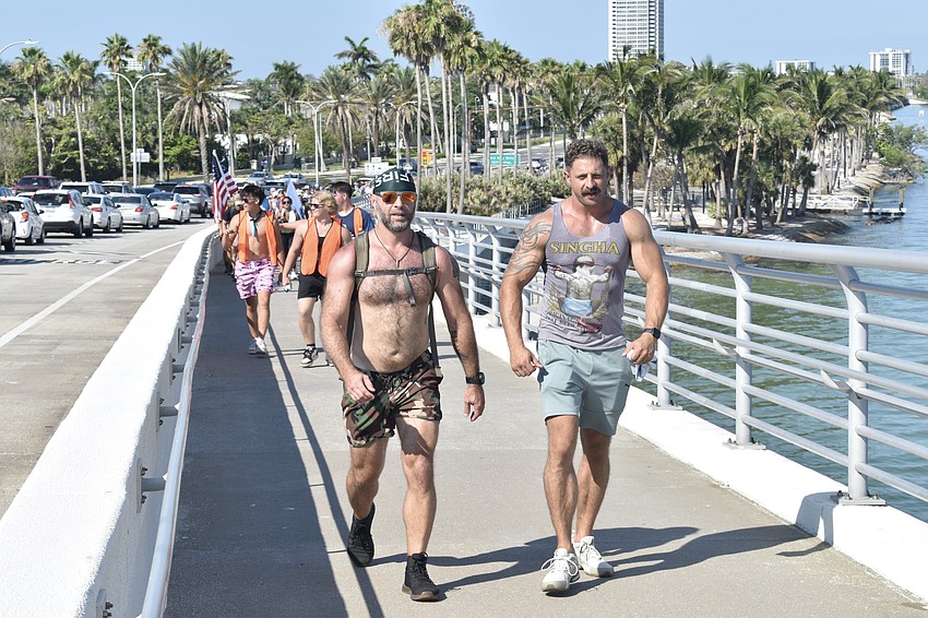 Joshua Ott and Charlie Reeder walk over the Ringling Bridge.