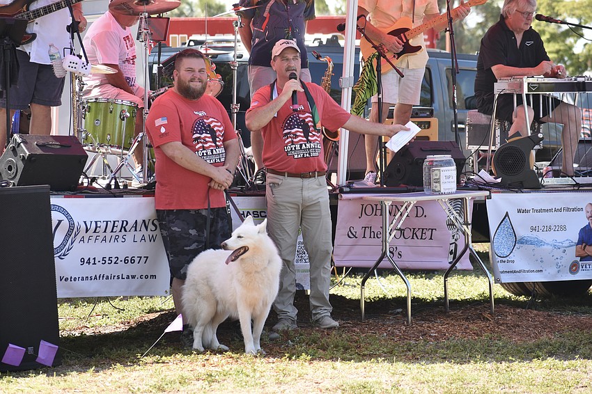 Todd Hughes, Ghost, and Rob Kehs of SRQ Vets make an announcement.