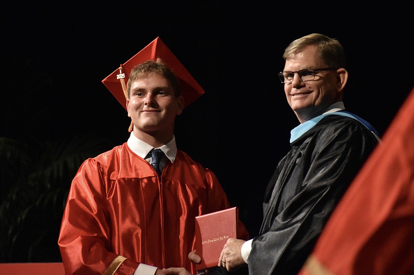 David Ignaczak receives his diploma from Principal Ben Hopper.