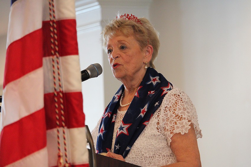 Singer Lorraine Murphy leads attendees in 