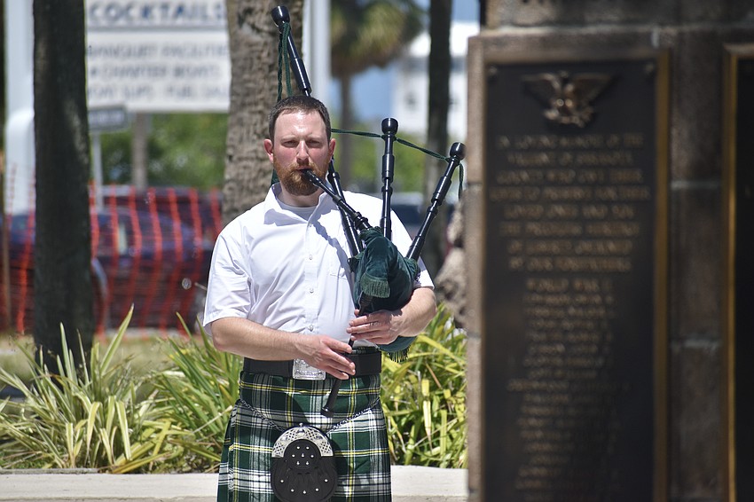 Emmett Atkins plays bagpipes.