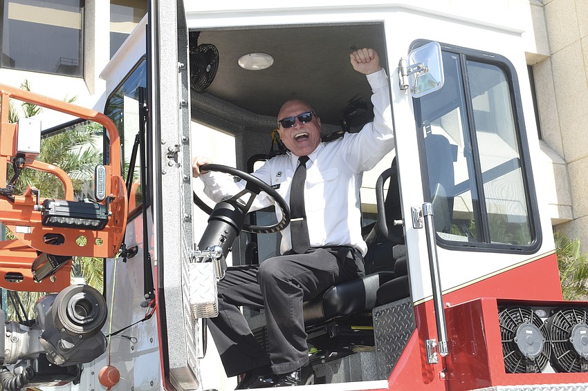 Sarasota Military Academy Major Michael Finley posed in a fire truck for a photo to send to his brother, Mitchell Finley, who just retired from 26 years at the Phoenix Fire Department in Arizona.
