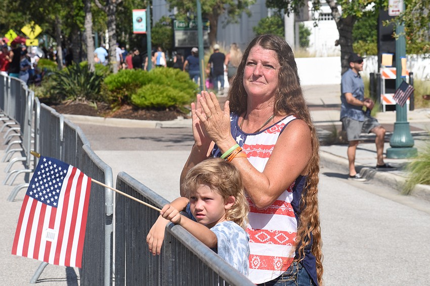 Ryder Raguth, 5, watches the parade with his grandmother Missy Raguth.