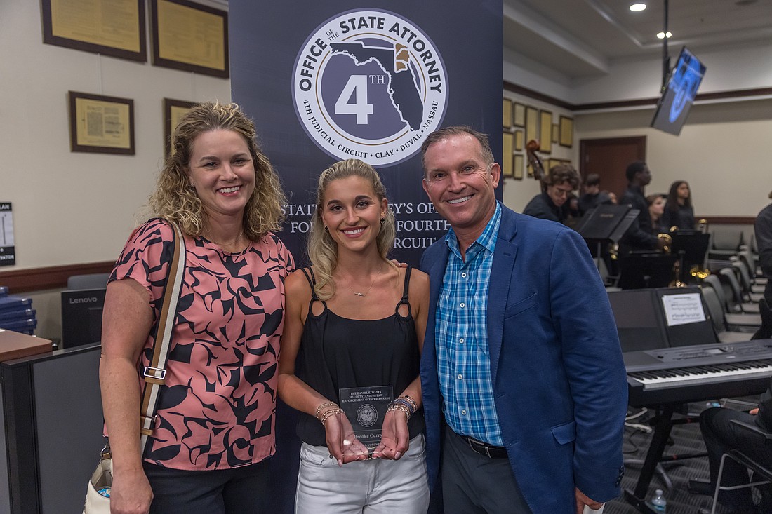 Brooke Curry, center, received The Citizen and Volunteer Partnership Award from the State Attorney’s Office for the 4th Judicial Circuit, joined by her parents, Molly and former Jacksonville Mayor Lenny Curry. Brooke Curry was recognized for her advocacy in the state Legislature’s approval of “Brooke’s Law” that helps protect young people from a form of cybercrime.
