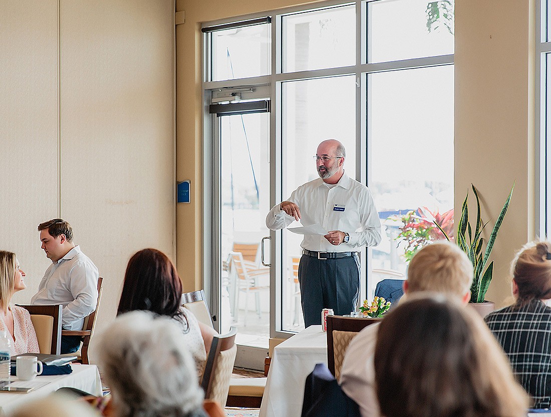 Doug Walters leading his team meeting at Walters and Associates.
