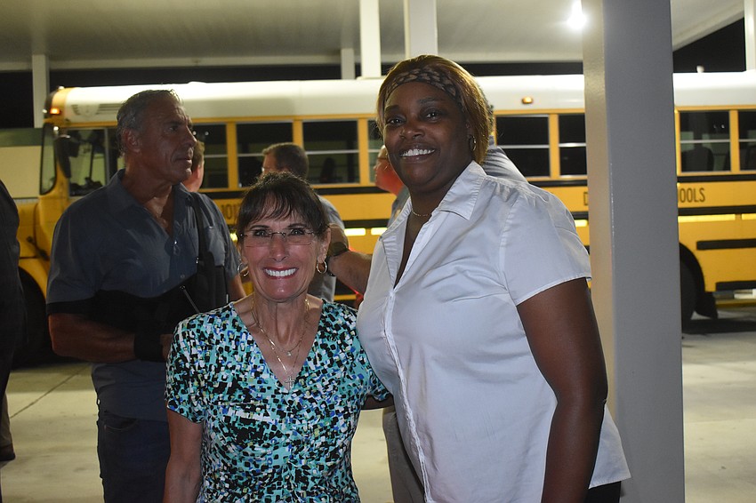 School board Member Cindy Spray and Assistant Director of Transportation Melanie Johnson arrived early Thursday to wave off the bus drivers.