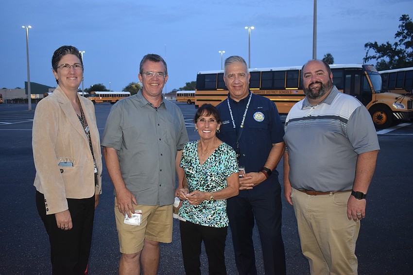 Manatee County School Board members Heather Felton, Charlie Kennedy, Cindy Spray, Richard Tatem and Chad Choate were among the wavers before the school busses left Thursday.