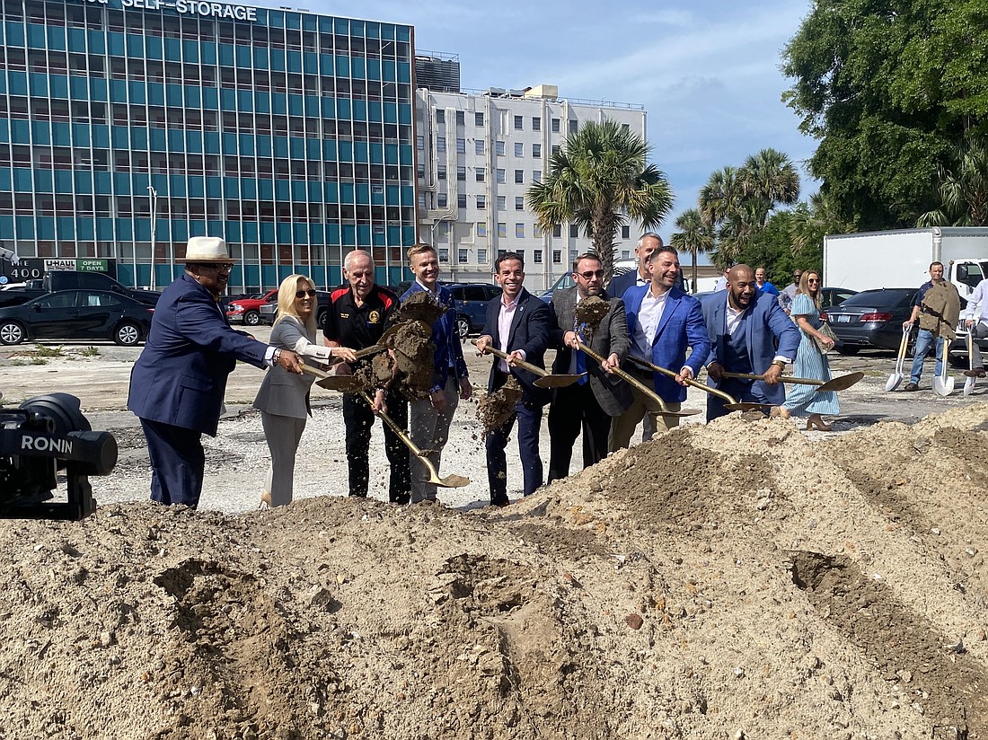 Gateway Jax CEO Brian Moll, fourth from the left and without a shovel, smiles as Council member Ken Amaro, Mayor Donna Deegan, and Council members Randy White, Raul Arias, Kevin Carrico, Jimmy Peluso and Rahman Johnson take part in the groundbreaking May 29 for 425 Beaver Street, the second project in Gateway’s Pearl Square development.