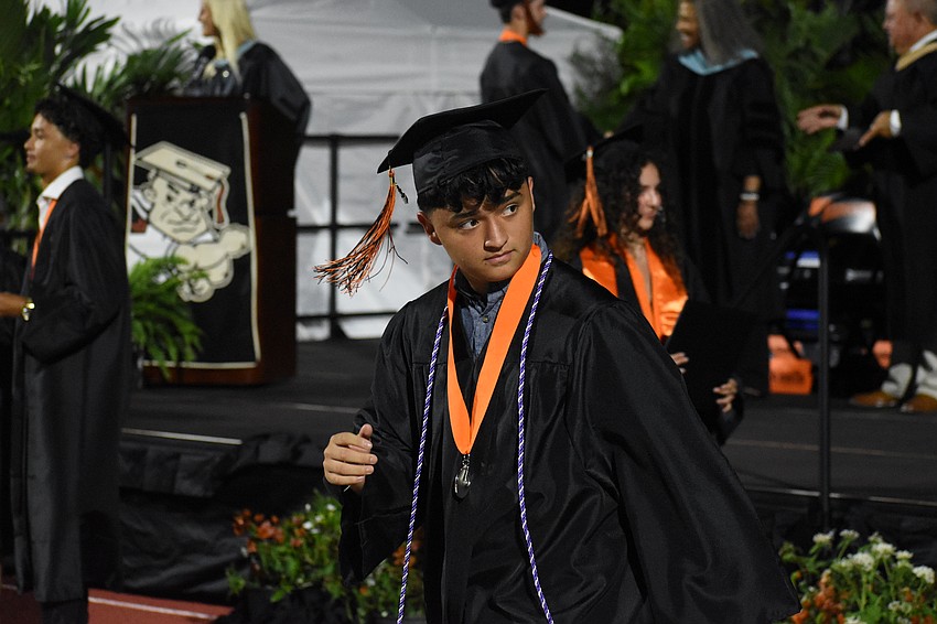 Enrique Coletti steps down from the stage.