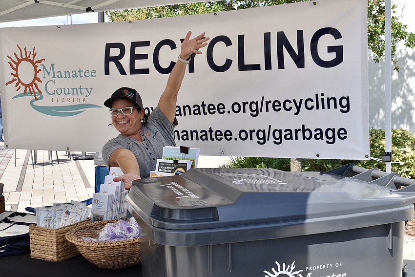 Mary Oquendo, the recycling coordinator for Manatee County, shows off the 