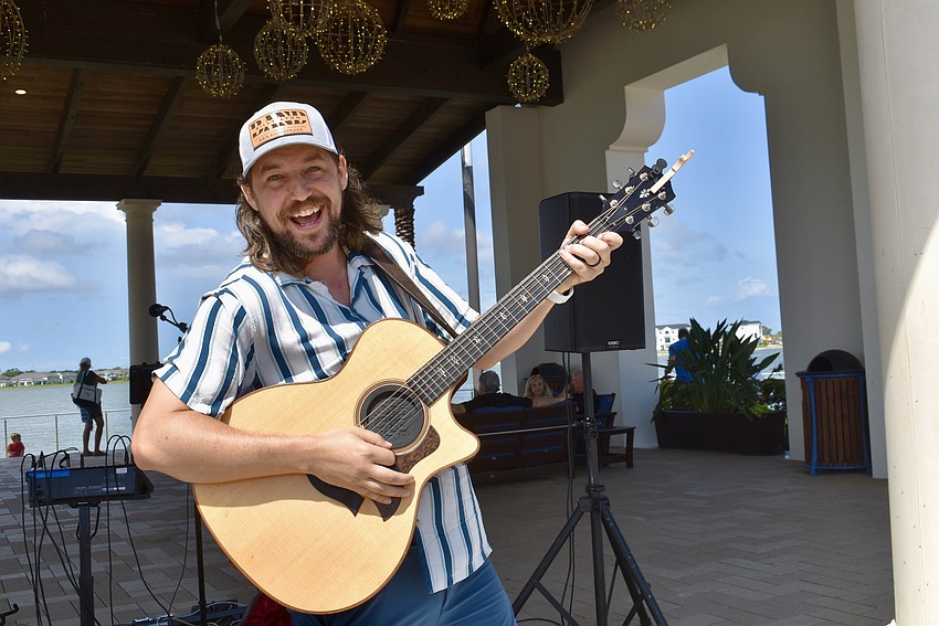 Sarasota musician Billy Lyon entertains the crowd solo. Normally he plays with The Billy Lyon Band.