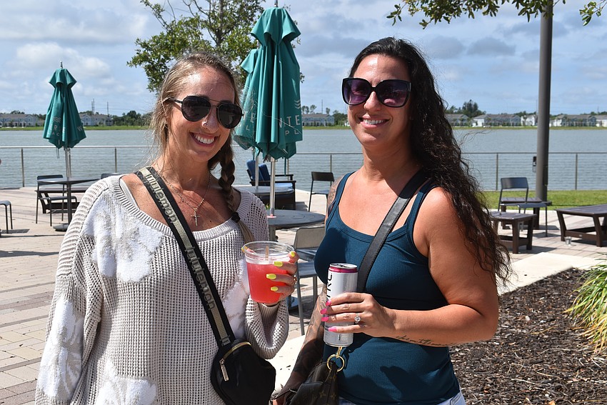 Parrish's Emily and Josie Bonfiglio enjoy a couple cocktails from Agave Bandido before wandering through the market.