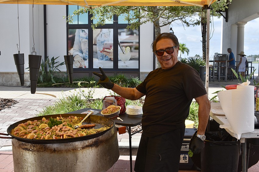 San Andres, Spain's Chef Efrain Martinez is serving the national dish of Spain — paella.