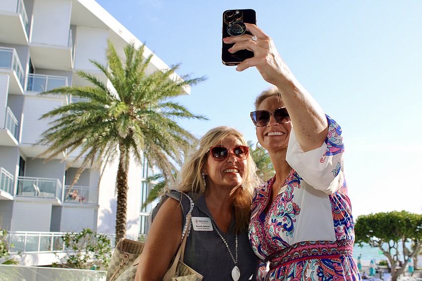 Brandy Britton of Bringman Roofing and Monica Carruth snap a photo during the Longboat Chamber of Commerce's latest 