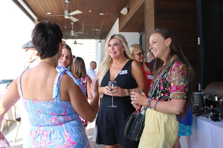 Guests including Amy Fehr from ABC7 converse at the Longboat Key Chamber of Commerce's latest 
