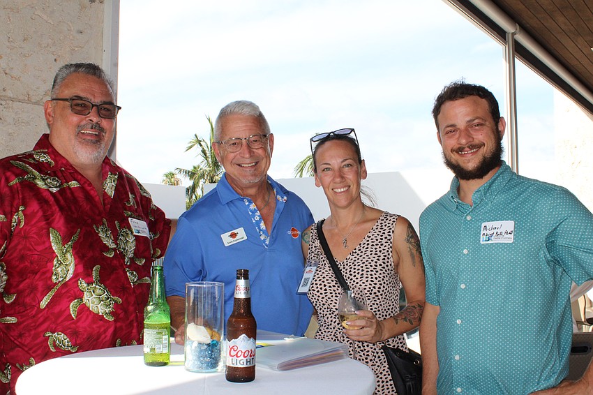 Ernie Vanderwalt, Scott Kuykendall, Kellie Spring and Michael Fletcher chat at the Longboat Key Chamber of Commerce's latest 