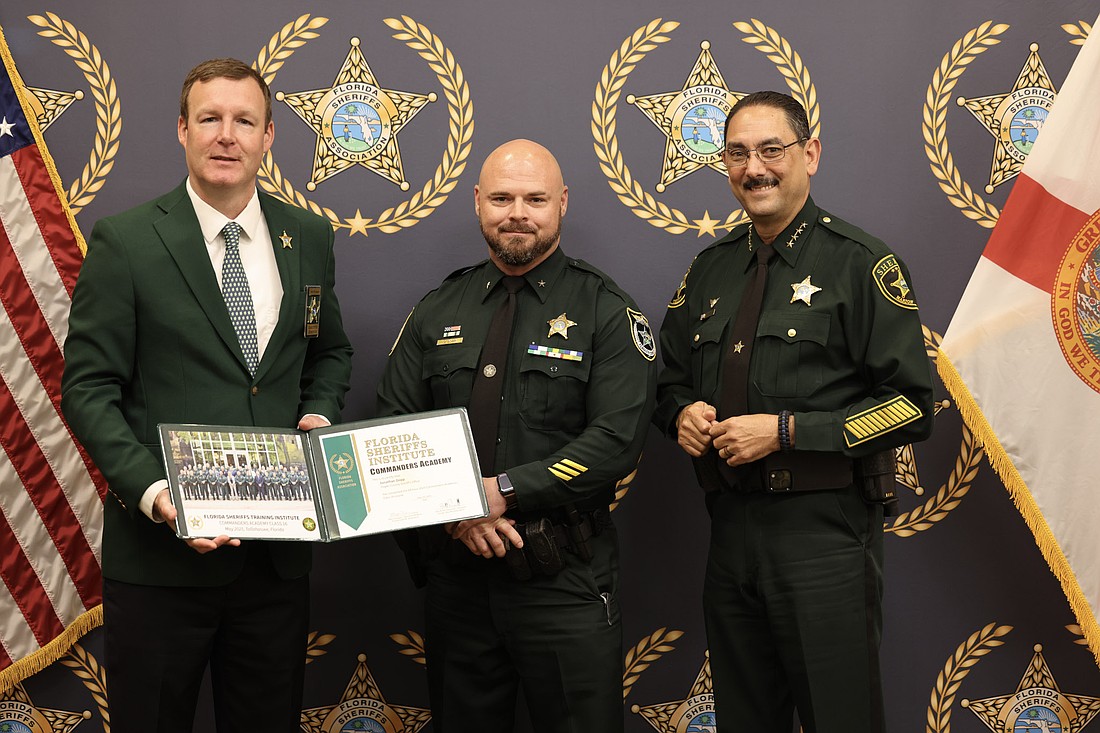 FCSO. Special Operations Cmdr. Jonathan Dopp (center) graduated from the FSA Commanders Academy in May. Courtesy of FCSO