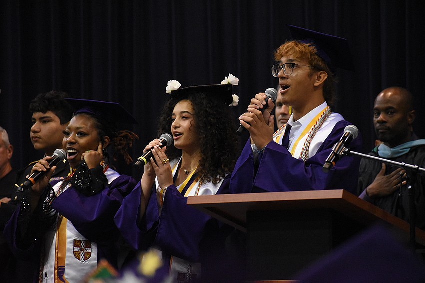 Lillian Jones, Yaira Spears and Jesus Cardoso sing the Star Spangled Banner.