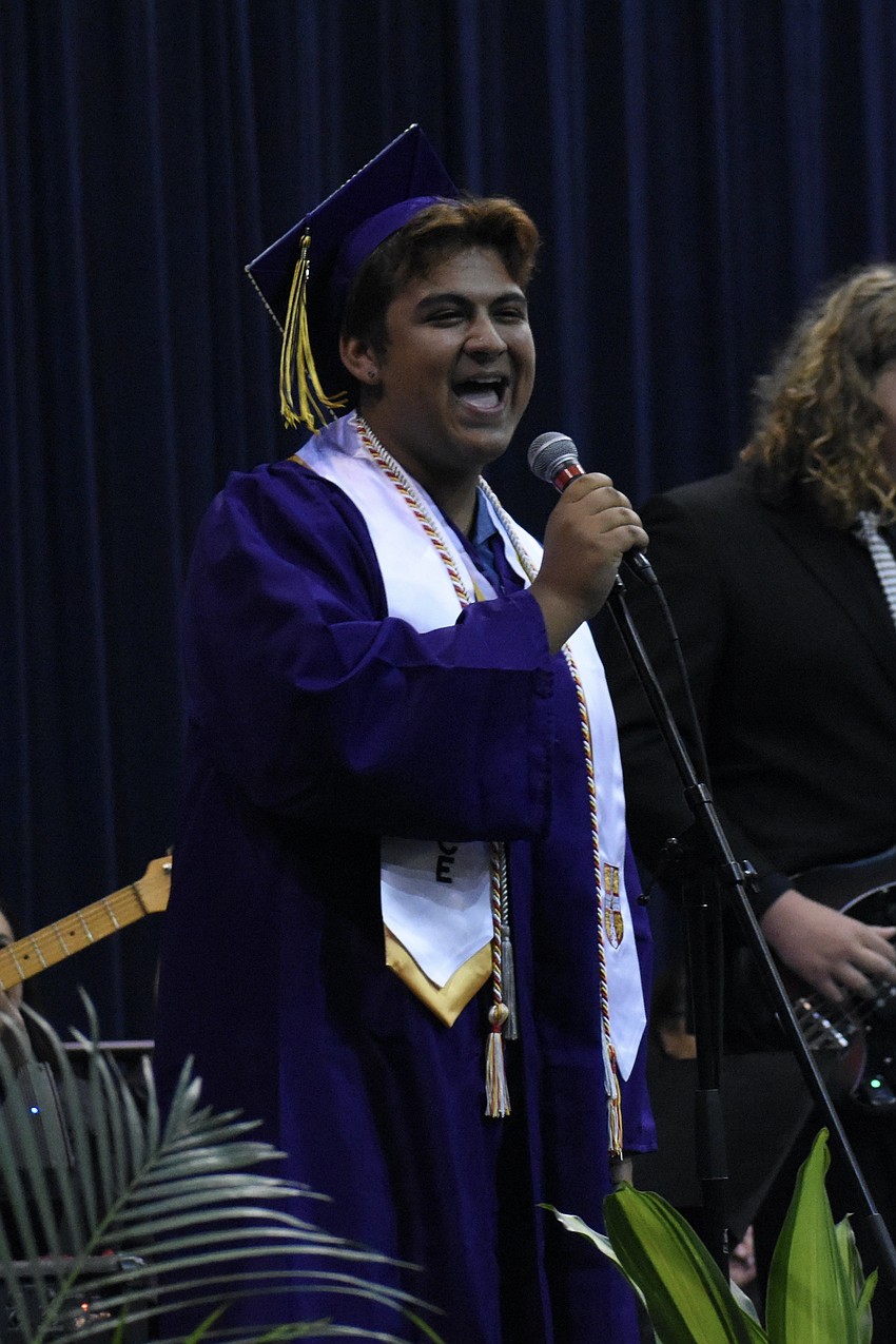 Kyle Ramon, with the VPA Modern Band, performs on stage.