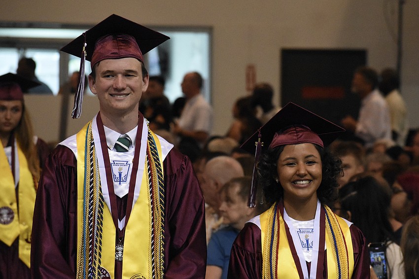 Michael Barry and Vanessa Andrade walk the aisle.